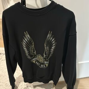 Anine Bing Black Sweatshirt with Gold Wing Graphic